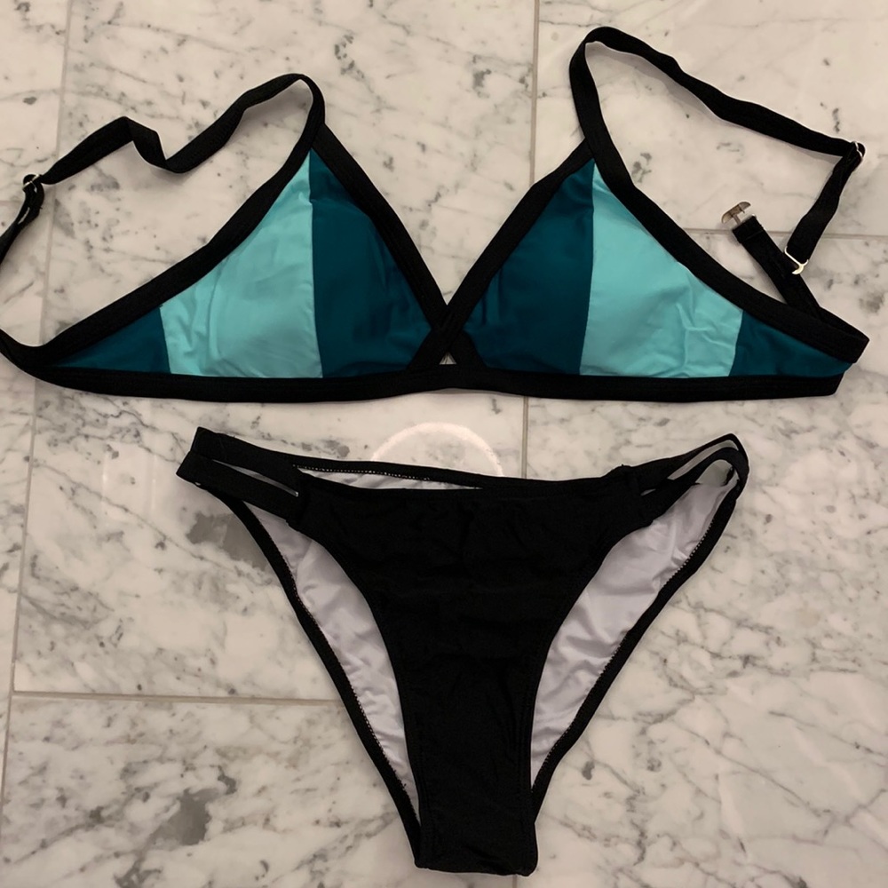 Color block green and bikini top with black cheeky bottoms
